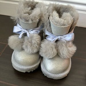 Size 8 toddler UGG silver pompom boots.   Hardly worn.  Great condition